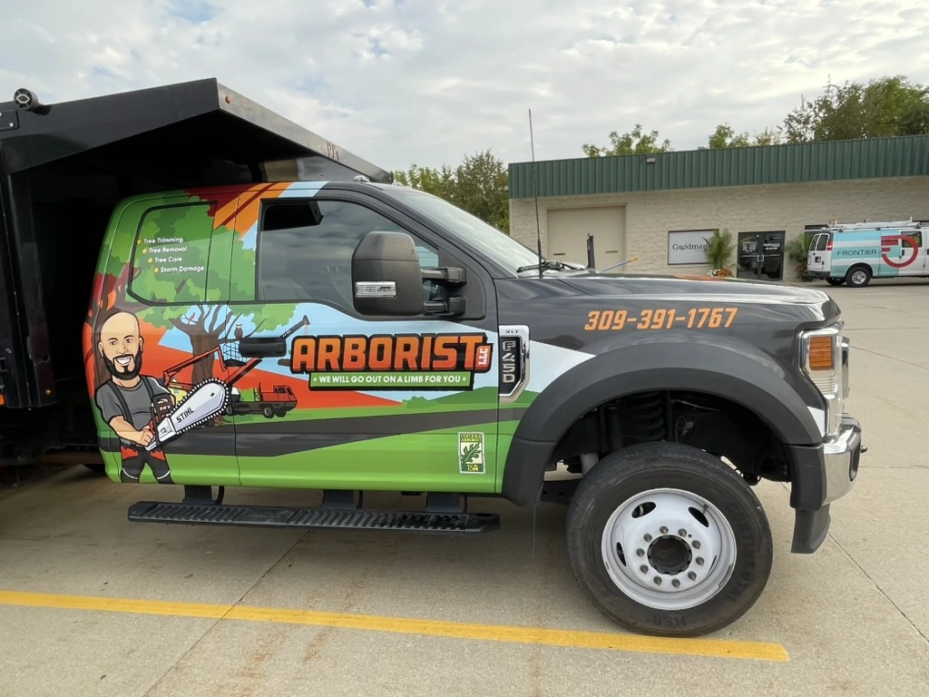 Arborist service truck wrap installed in Bloomington IL by Simply Divine Signs & Wraps