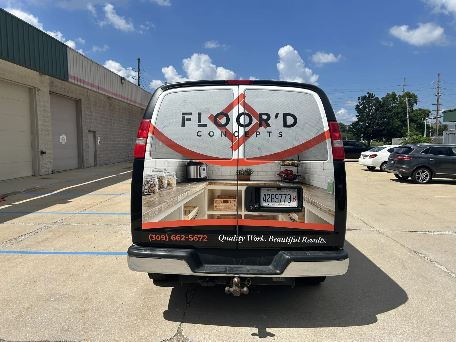 Rear of the Floor'd Concepts Express van with pantry photography across the doors and perforated window film above.