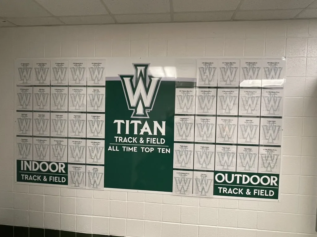 Illinois Wesleyan track and field record board with printed record inserts in place, Bloomington, IL.