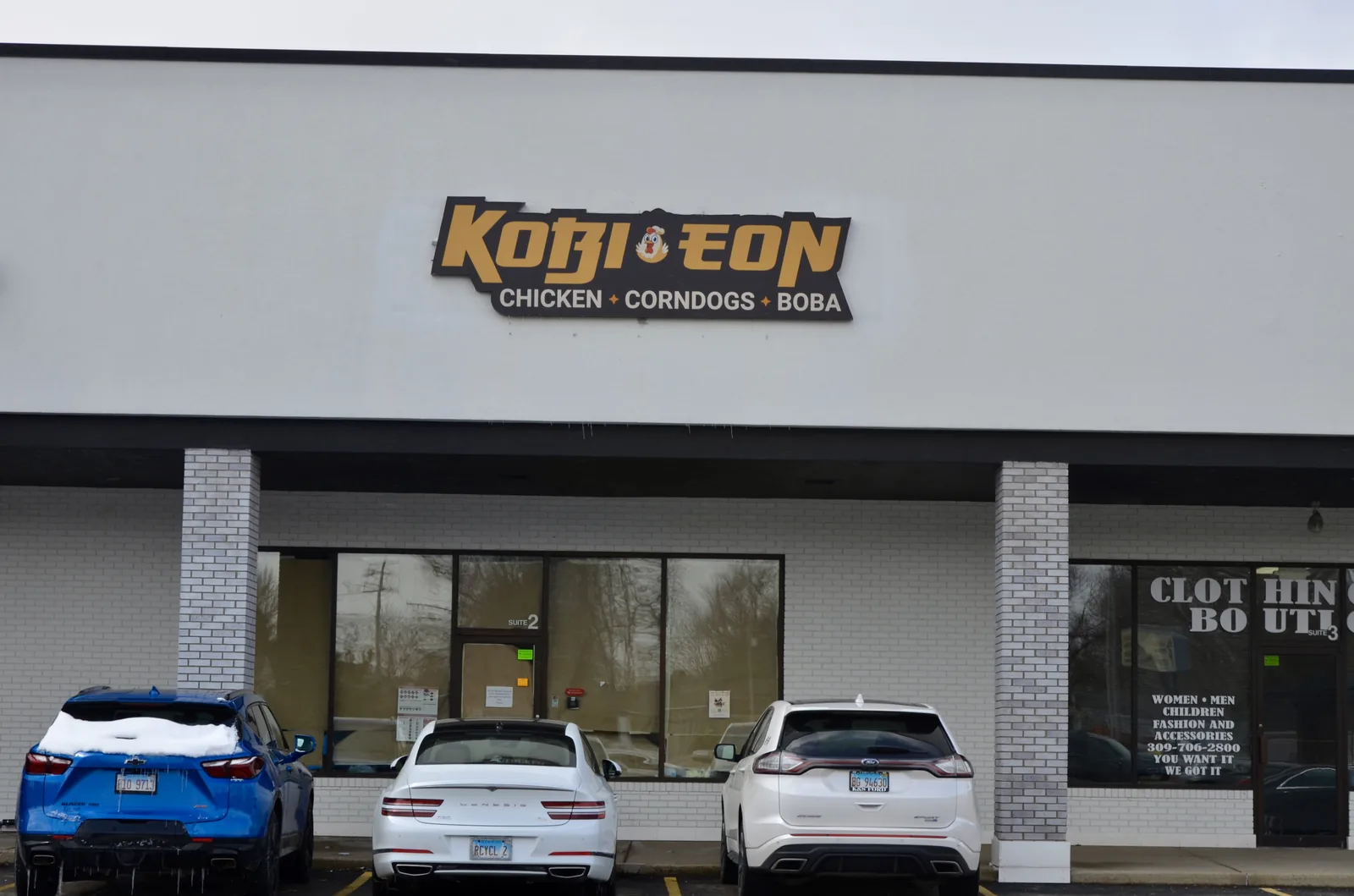 Kobi-eon dimensional building sign installed above the storefront in Normal, IL.