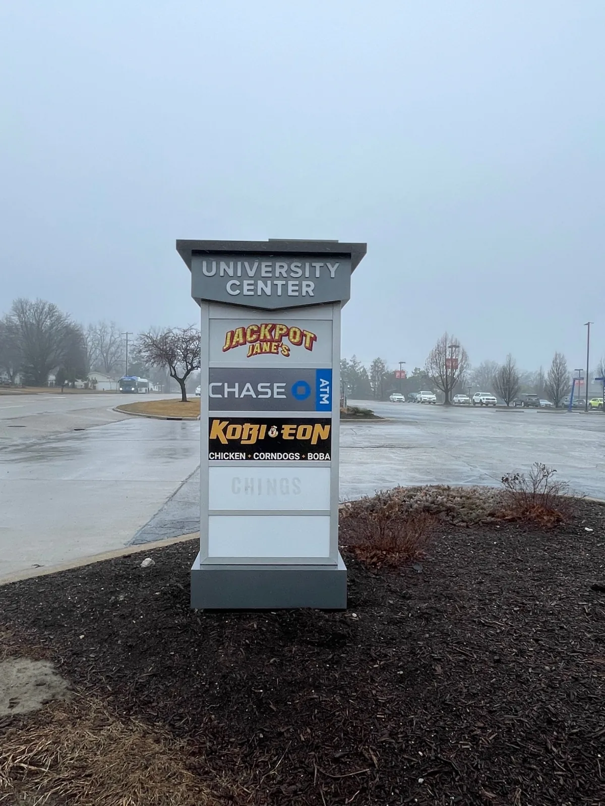 Kobi-eon panel installed on the shared University Center tenant monument in Normal, IL.