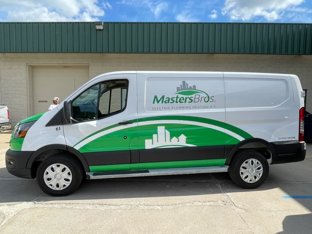 Driver side of the same Ford Transit, carrying the same graphics on an unbroken body panel.