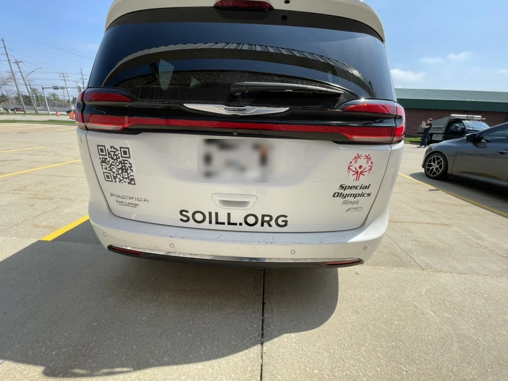 Rear of the Special Olympics Illinois Chrysler Pacifica minivan with cut vinyl decals and lettering.