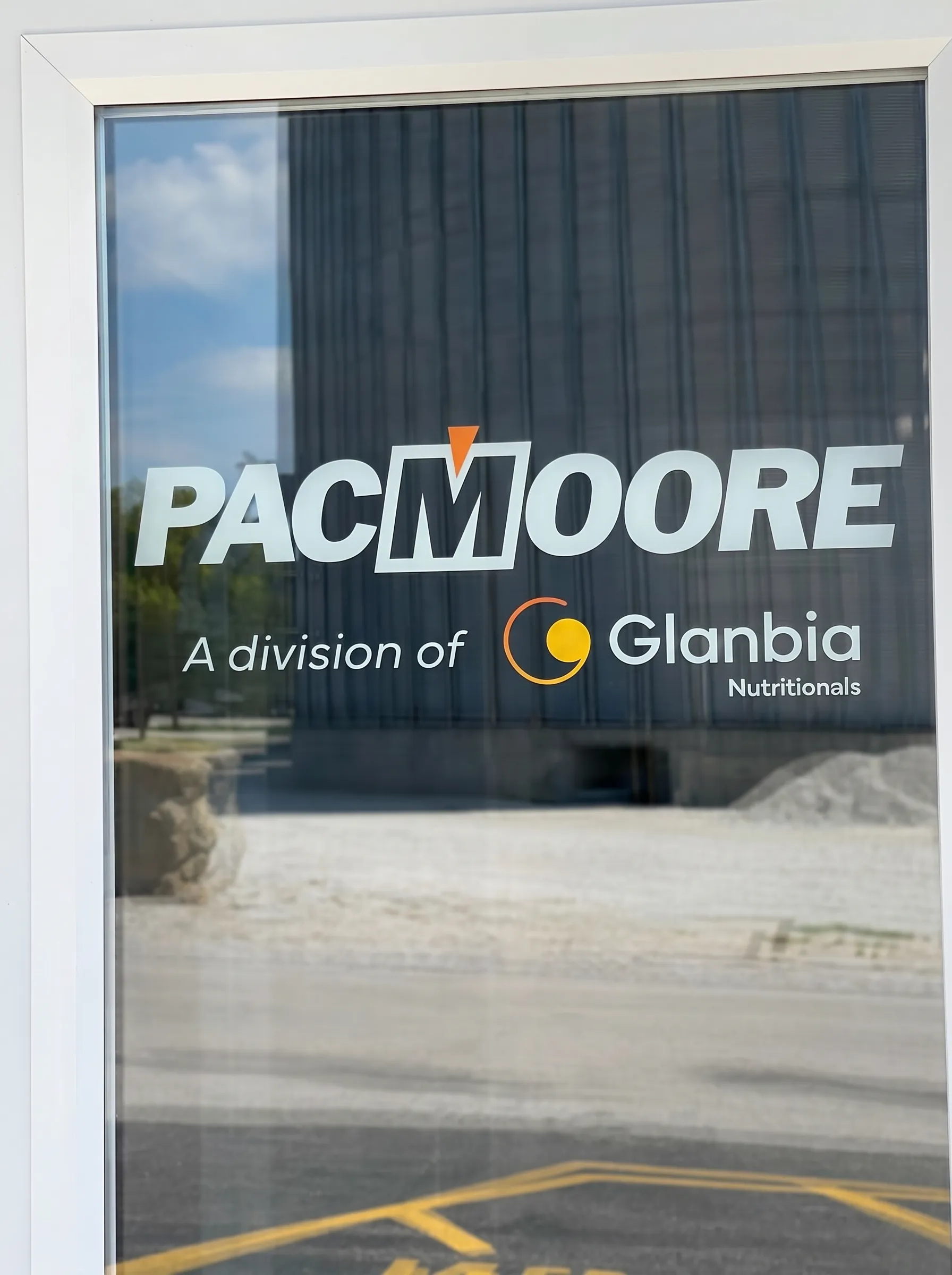 PacMoore — Corporate window logo installation