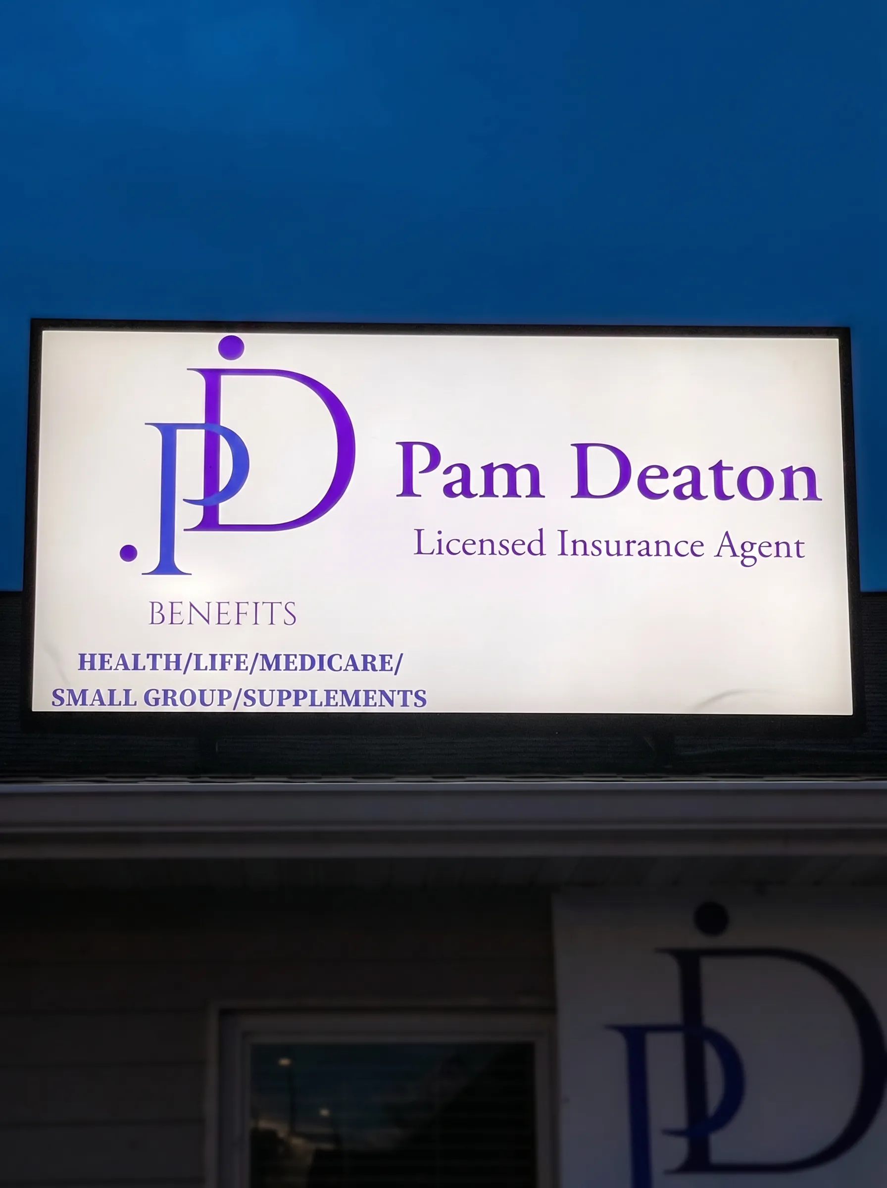 Pam Deaton Benefits — Illuminated insurance office sign