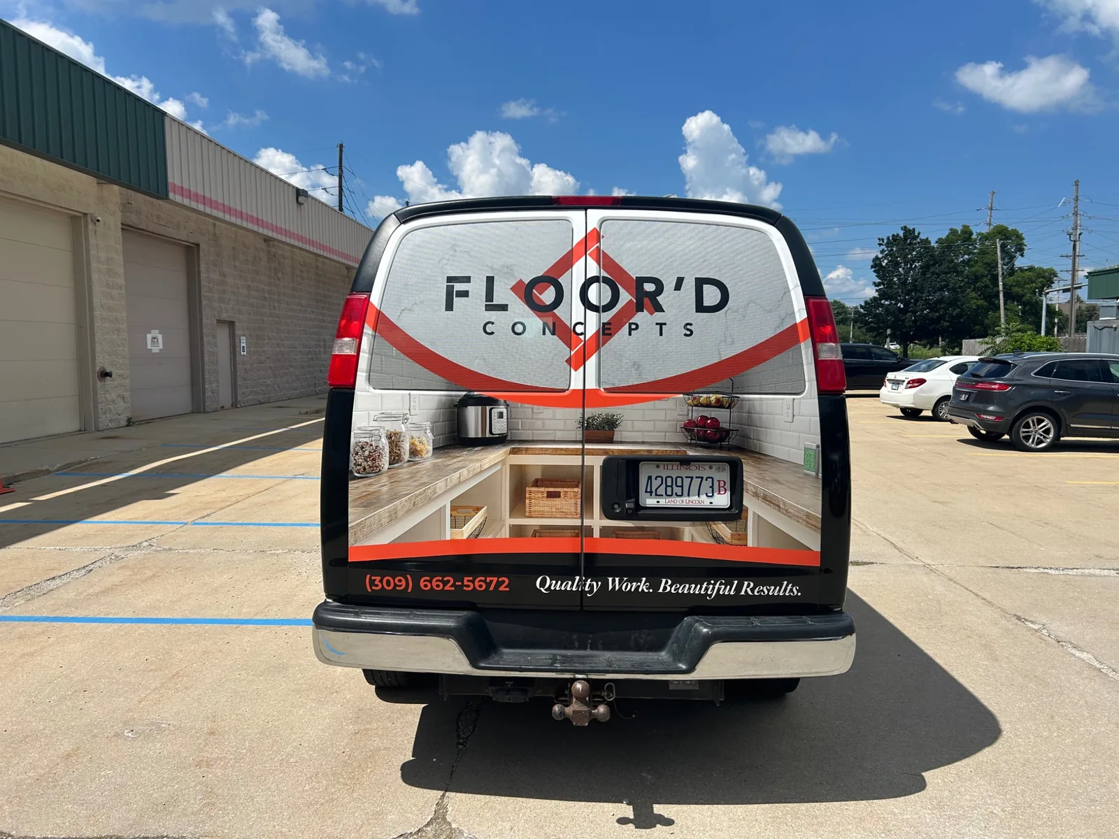 Rear-door view of the finished Floor'd Concepts commercial van wrap in Normal, Illinois.